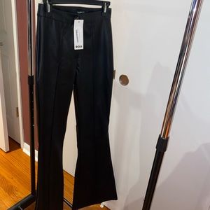 Woman leather wide leg trousers.